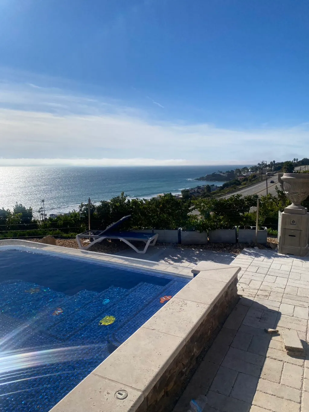 Pool-deck view of a coastal Southern California property — the kind of high-humidity environment that drives mold growth.